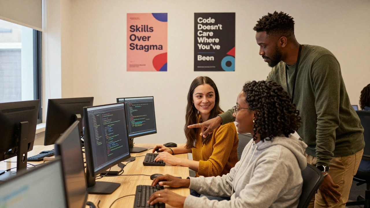 Three women learn to code together in a supportive training room, focused and hopeful.